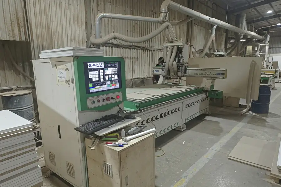 Secondary view of automated CNC processing at Goldenland Furniture factory.
